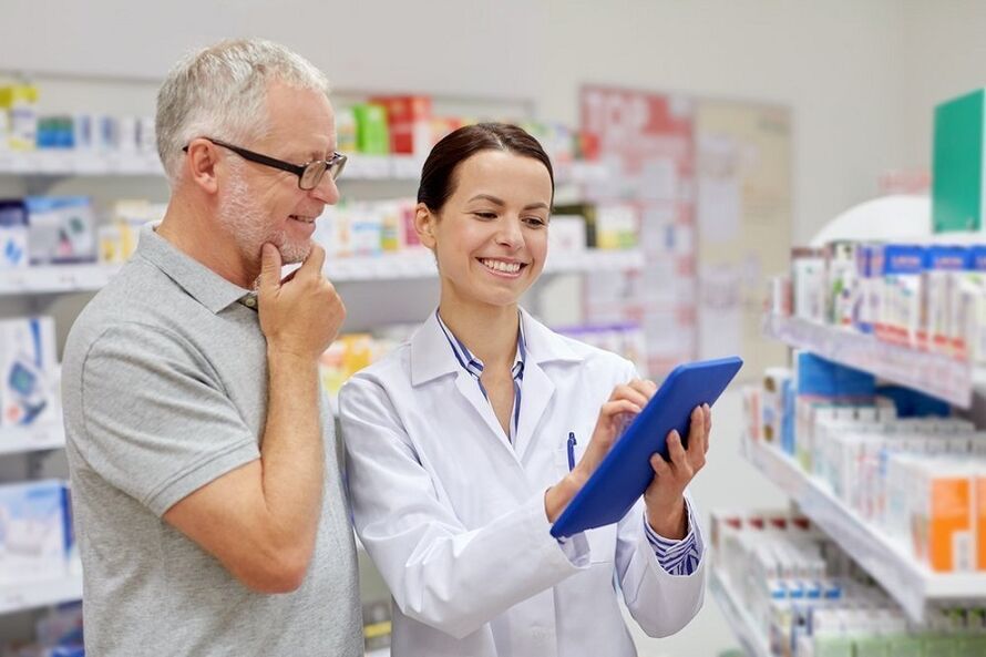 The doctor prescribes medicine for parasites to the man